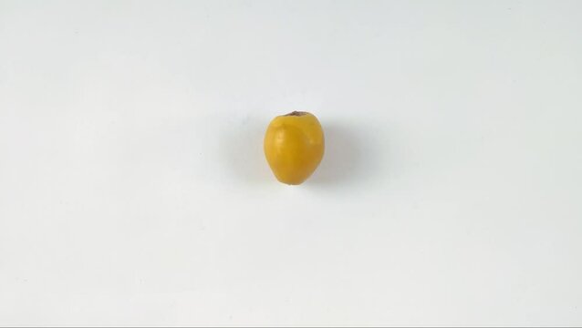 A fresh young dates or rutob dates or ruthob dates on a white background.