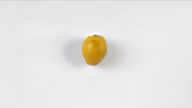 A fresh young dates or rutob dates or ruthob dates on a white background.