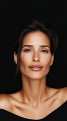 Obraz premium Radiant beauty portrait showcasing healthy skin on black background