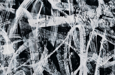 Abstract background with chaotic white brush strokes on a dark surface. Perfect for design, posters, banners, and social media. 