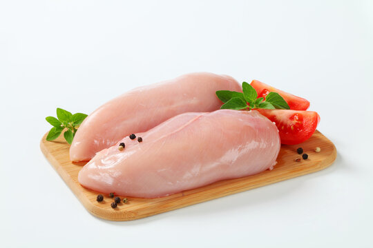 Raw skinless chicken breast fillets