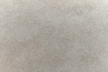 abstract background of embossed plastered wall painted greyclose up
