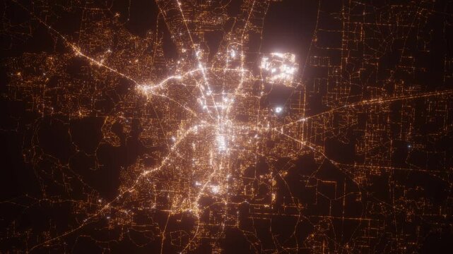 Tallahassee (Florida, USA) aerial view at night. Top view on modern city with street lights. Camera is zooming out, rotating clockwise. Vertical video. The north is on the left side