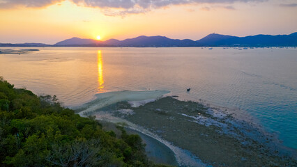 Aerial top view of sandbar of island in middle of the sea, white purity sand beach island locate in Phuket of Thailand