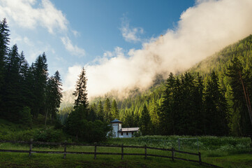 Mount Catinaccio seen from Pozza di Fassa with a cloudy sky, Trento