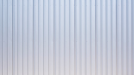 Fototapeta premium Silver aluminum corrugated steel fence or industry warehouse building wall background