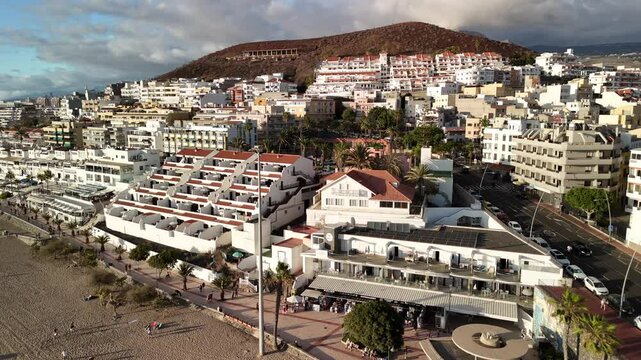  coastal views of Los Cristianos in Tenerife with scenic architecture and vibrant activity