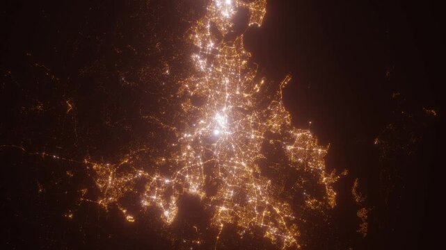 Brisbane (Australia) aerial view at night. Top view on modern city with street lights. Camera is zooming out, rotating clockwise