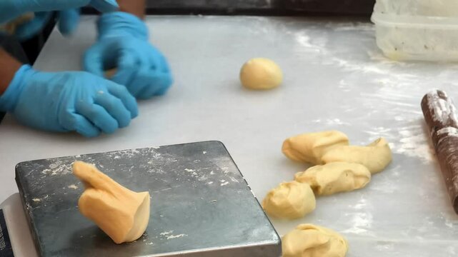 A glimpse into a bustling bakery where skilled chefs prepare fresh ingredients with care