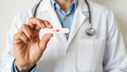Doctor showing pregnancy test result in clinic for blogs, websites, health education, pregnancy awareness campaigns, medical presentations, and informational resources