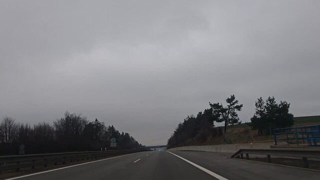 Timelapse video from car driving on D1 highway between Brno and Prague, illustrating major Czech motorway and daily commuting route-weeknd low traffic with cloudy sky and clouds before rain