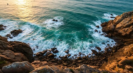 Aerial View of Ocean Waves Crashing on Rocky Coastline at Sunset