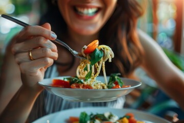 Close up of a woman relishing a forkful of pasta