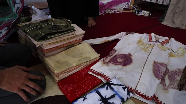 pile of clothes on the floor, batik cloth