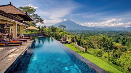 Obraz premium luxurious bali villa with infinity pool and volcano view