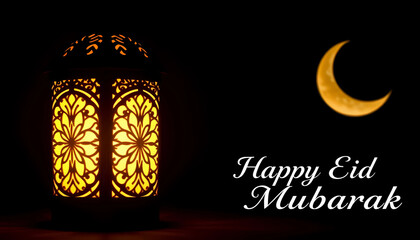 A beautifully designed lantern with intricate patterns, glowing softly in a dark setting, alongside a crescent moon in the background. The text Happy Eid Mubarak is elegantly displayed.