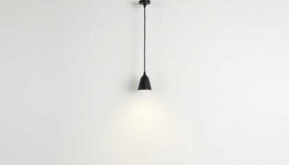 Minimalist pendant light hanging from ceiling, casting soft glow against plain wall, creating serene atmosphere