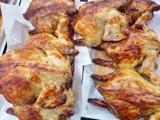 Roasted chickens top view close up image.