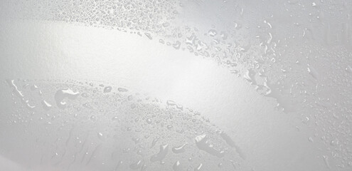 Wipe the glass pane with a glass cleaner and rubber puller. Hygiene, waterdrops or splashes,...