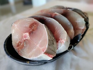 Raw sliced tuna fish background.