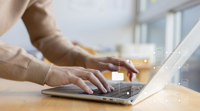 close up employee user man hand work on laptop with virtual icon of DMS (document management system) to access database on enterprise platform for modern technology business organization concept