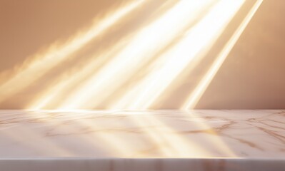 A marble desk or tabletop illuminated by strong, angled beams of golden sunlight streaming across a warm beige background.