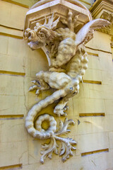 This sculpture of the mythical dragon-like creature is located on a historic building in Don Juan...