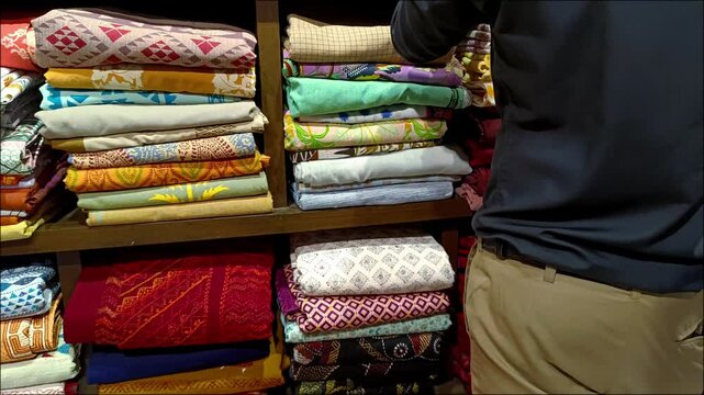 Readymade Garments in Bangladesh. Salesman in a Clothing Store.