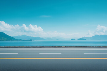 Scenery of coastal highway with distant mountains and blue sky