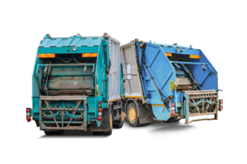 Two garbage trucks are parked in a remote location, ready for waste collection. The trucks feature distinct colors and designs, highlighting their purpose.