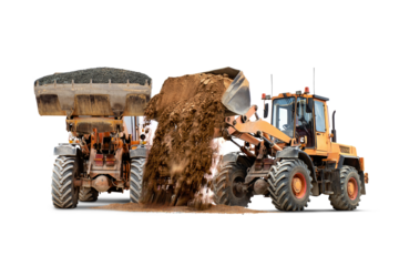 Two loaders work together to transport and unload large quantities of soil and gravel on a remote construction site. Construction equipment rental.