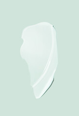 Face or body white cream swatch hair balm or melted wax on cool blue green background