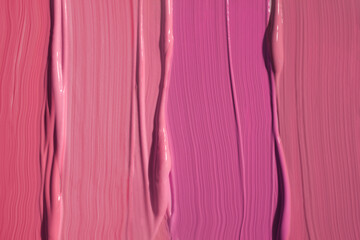 Cosmetic texture lip gloss, creamy lipstick or blusher red burgundy beige pink smudge textured background