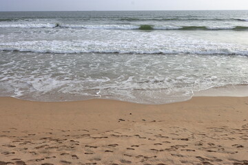 Aerial view of beautiful waves crashing on the rocky island coast, ocean waves and fantastic