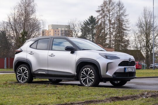 Silver Toyota Yaris Cross XP210 hatchback car with black roof parked on street