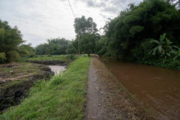 Footpath along the river. The small road is still dirt