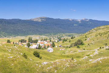 View of country in Bosnia and Herzegovina, Europe. Mountain village nestled in a green valley...