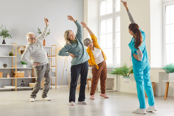 Female nurse or physiotherapist doing healthy stretching exercises for wellness and health with a...