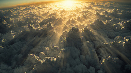 Sunlight rays breaking through dramatic clouds with radiant glow and soft golden light over expansive sky, scenic sunrise and cloudscape for inspirational nature and atmospheric sky backgrounds