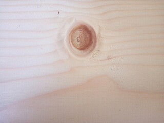 Close-up view of wooden board with a knot