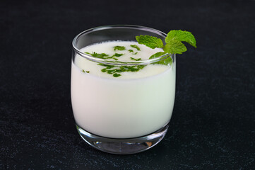 Serving Indian buttermilk in a glass cup.