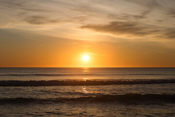 The sun reflecting on the sea in the golden hour in the atlantic ocean in Cadiz, Spain. Reflection...