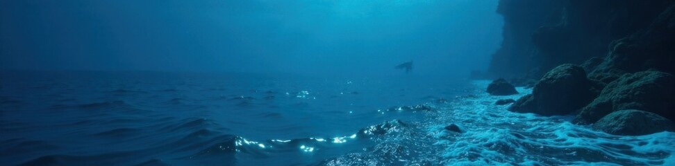 Fototapeta premium Diver's view of calm dark blue ocean surface with waves gently lapping at the edges, reflection, calm ocean, underwater view