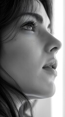 Fototapeta premium Profile of a woman with striking features in soft light