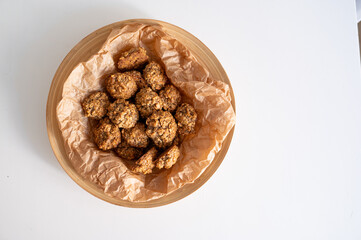Homemade oatmeal cookies are lying on the plate. Homemade biscuits. Bakery. Vegetarian food. Healthy breakfast