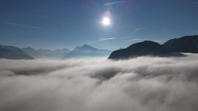 1. Majestic Mountain Peaks Emerging from a Sea of Clouds &ndash; Aerial View

