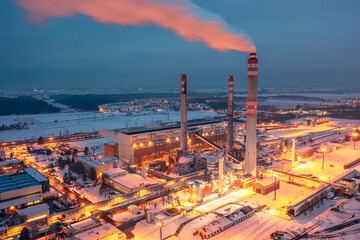 Coal power plant in winter evening produces electricity and heating for east bohemia households. Industrial landscape.