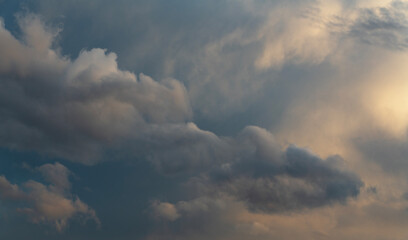 Beautiful bright evening sunset sky with dark  clouds. Sunset sky background.