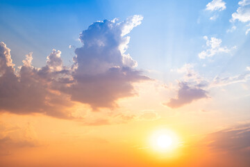 Obraz premium Sky,sunset, beautiful , luxury soft gradient orange gold clouds and sunlight on the blue sky perfect for the background, Sunrise on morning or evening in winter warm time ,Twilight summer,silhouette