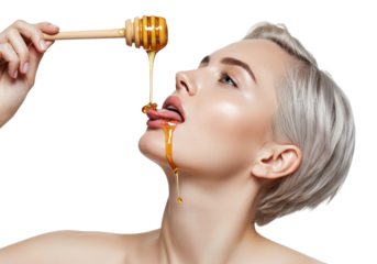 A woman with short, light hair is tilting her head back while holding a wooden honey dipper on a transparent background.